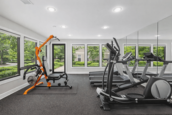 Fitness center with cardio machines and large windows